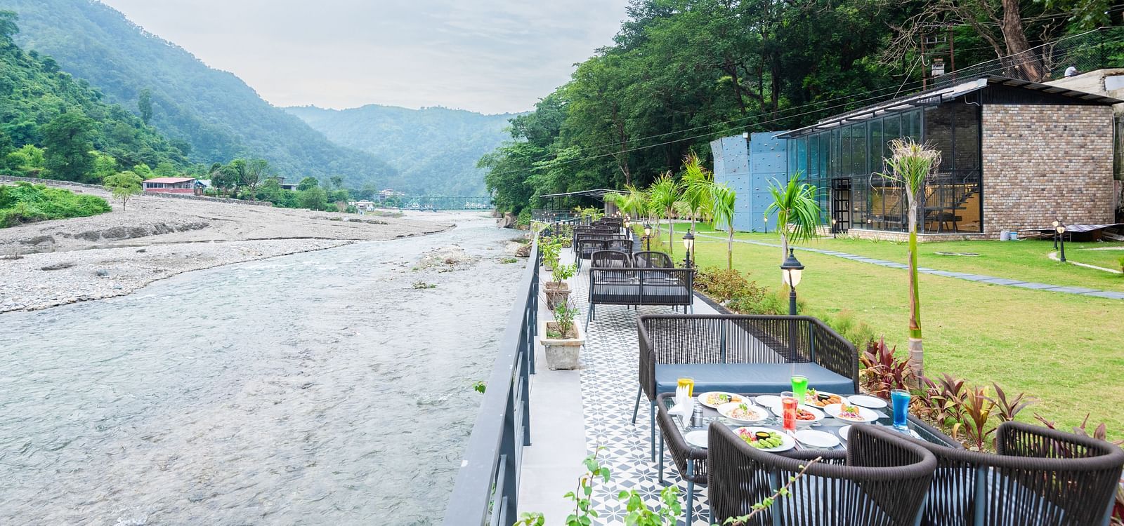 Restaurant dining area at DLS Divine River Resort and Spa featuring stunning views o f the river